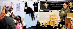 FARMERS' MARKET DRAWS A LARGE CROWD