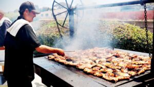 Chicken cooks at the Foundation for Suicide Prevention fundraiser. (Photo by Chris Frost)